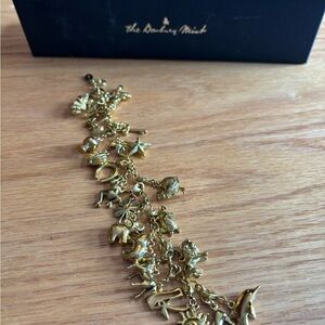 The Danbury Mint 21 Gold Tone Charm Bracelet Animals/ Celestial/nature/symbols